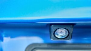 luxury blue car rear view camera for parking assistance selective focus closeup with copy space concept of safety car driving while parking process assist device equipment in modern cars
