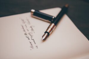 fountain pen and paper book poetry
