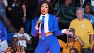 Megan Thee Stallion Performed at the Kamala Harris in a Custom Blue Abdul Sall Couture Suit and Tie feat image