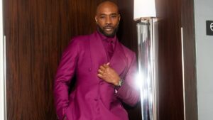 Morris Chestnut Posed in a Maroon Gregoire By Paris Suit While Doing Press Feat image