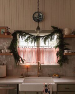 cozy kitchen garland greenery beadboard walls cottage christmas